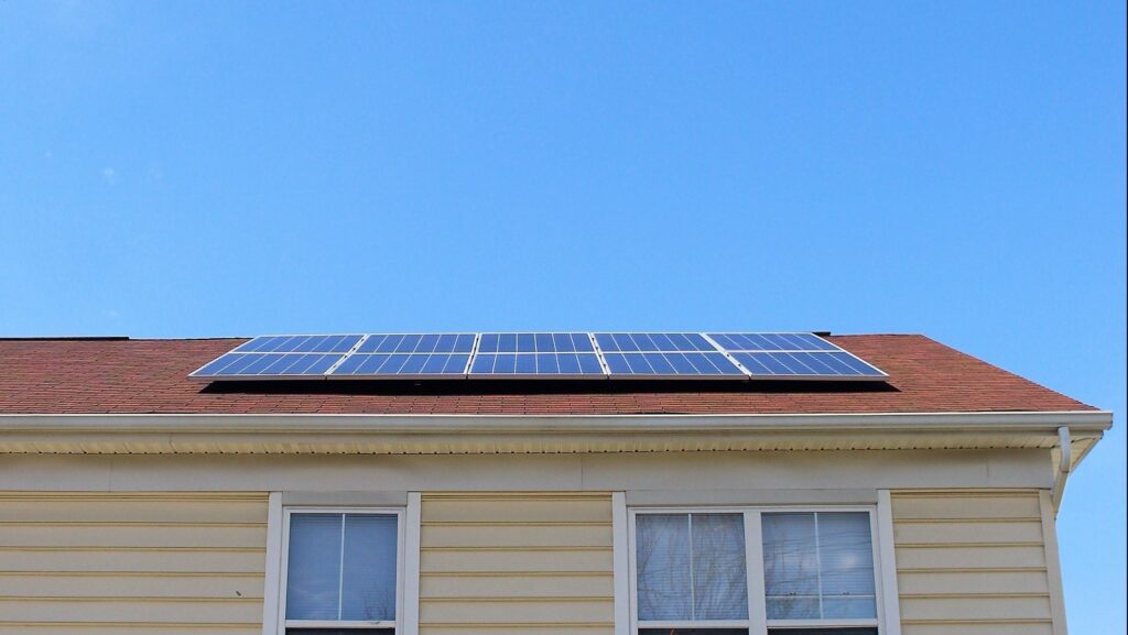 Solar panels on roof with asphalt shingles