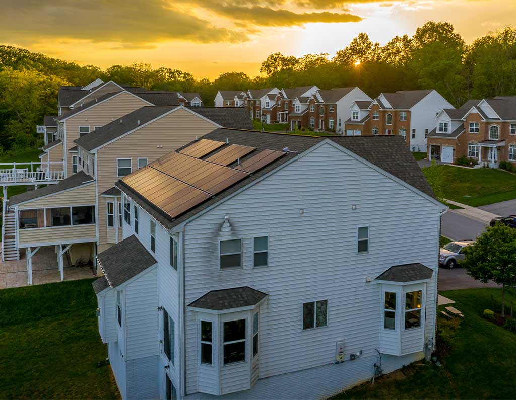home with solar panels installed in a neighborhood