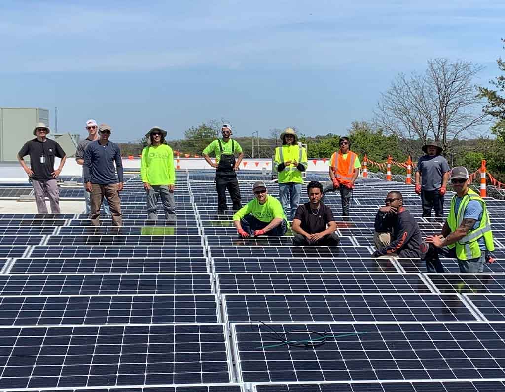ipsun solar team on roof installing solar panels