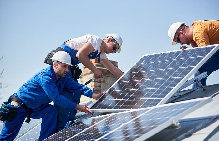 DC team engineers installing stand-alone solar photovoltaic panel system