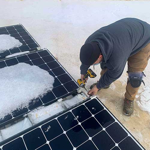 Northern VA solar panel installation contractor working on solar panels